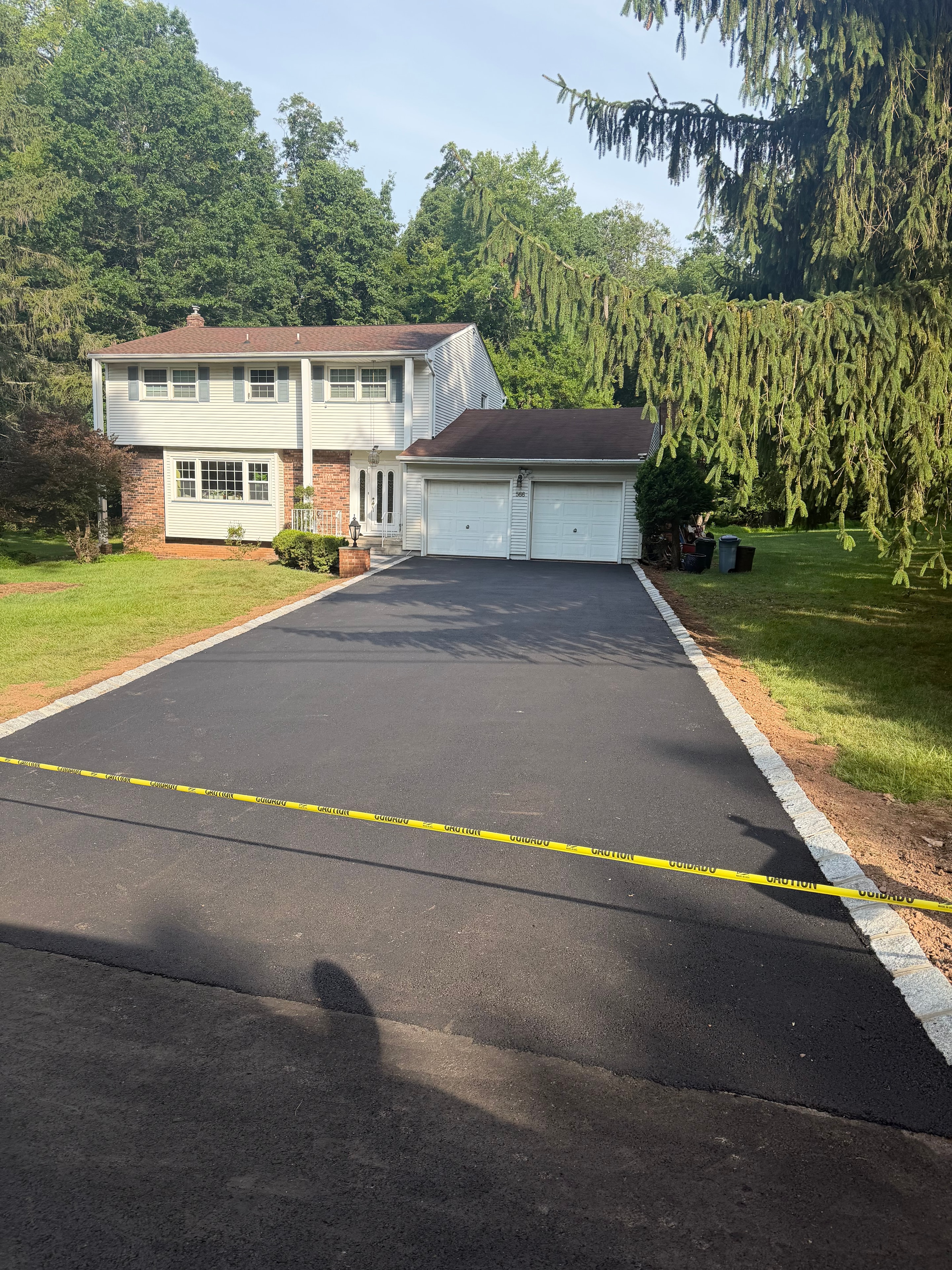 Newly completed residential asphalt driveway in New Jersey by HomeCraft Paving & Masonry