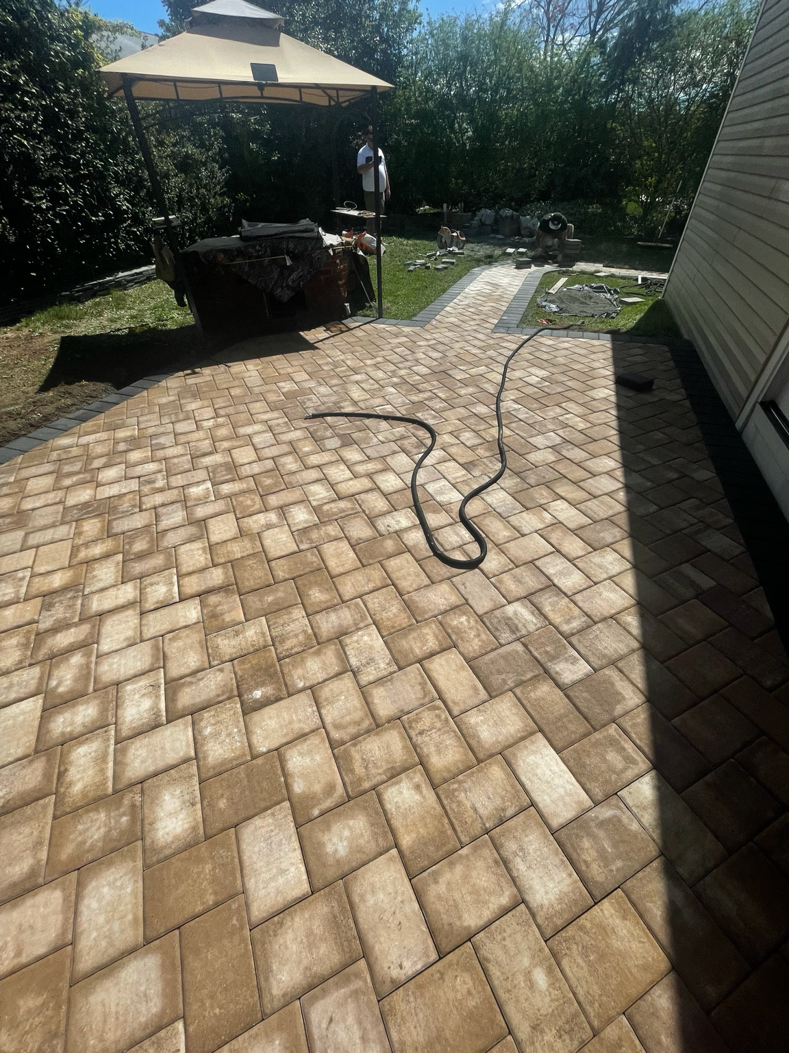 Tumbled paver patio and walkway installation by HomeCraft Paving & Masonry in New Jersey